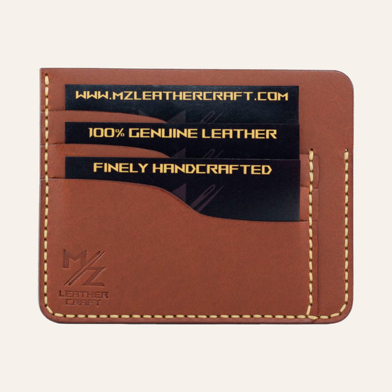 MZ Leather Craft kiremit Buttero deri ters cüzdan, kartlarla dolu düz ön görünüm, 3 ön kart yuvası, sarı el dikişleri ve kabartmalı MZ logosu | The Inverse Wallet - Chestnut Buttero Leather by MZ Leather Craft, flat front view filled with cards, featuring 3 front card slots, yellow hand-stitching, and embossed MZ logo