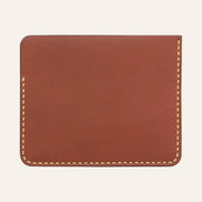 MZ Leather Craft kiremit Buttero deri ters cüzdan, kesintisiz düz deri paneli ve çevreleyen sarı el dikişlerini gösteren arka görünüm | The Inverse Wallet - Chestnut Buttero Leather by MZ Leather Craft, flat back view showcasing the seamless leather panel and surrounding yellow hand-stitching