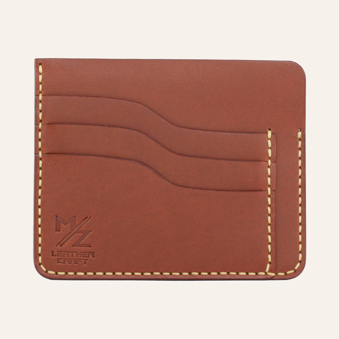 MZ Leather Craft kiremit Buttero deri ters cüzdan, 3 boş kart yuvasını ve mat deri dokusunu gösteren düz ön görünüm, sarı el dikişleri ve kabartmalı MZ logosu | The Inverse Wallet - Chestnut Buttero Leather by MZ Leather Craft, flat front view showing 3 empty card slots and matte leather texture, with yellow hand-stitching and embossed MZ logo
