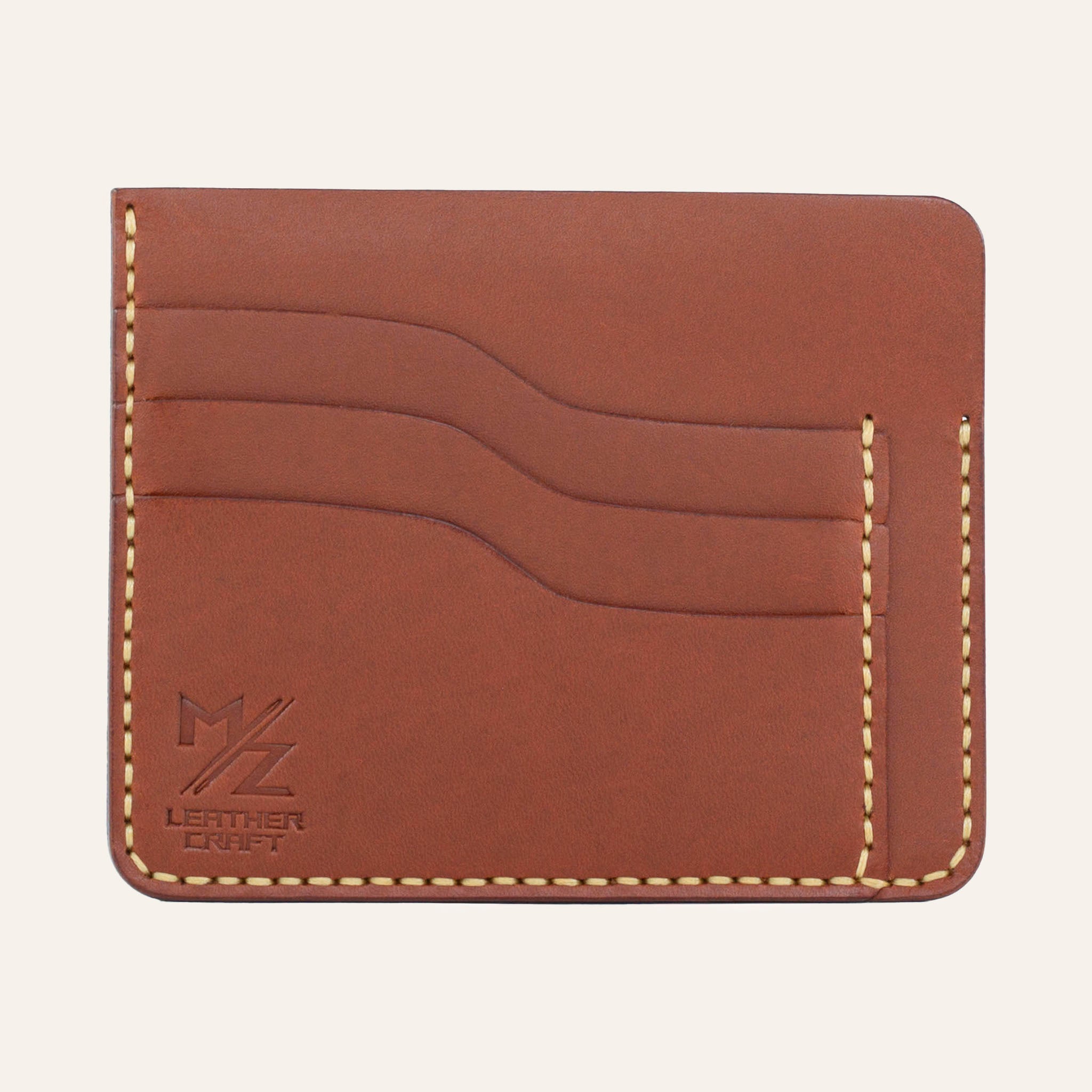 MZ Leather Craft kiremit Buttero deri ters cüzdan, 3 boş kart yuvasını ve mat deri dokusunu gösteren düz ön görünüm, sarı el dikişleri ve kabartmalı MZ logosu | The Inverse Wallet - Chestnut Buttero Leather by MZ Leather Craft, flat front view showing 3 empty card slots and matte leather texture, with yellow hand-stitching and embossed MZ logo