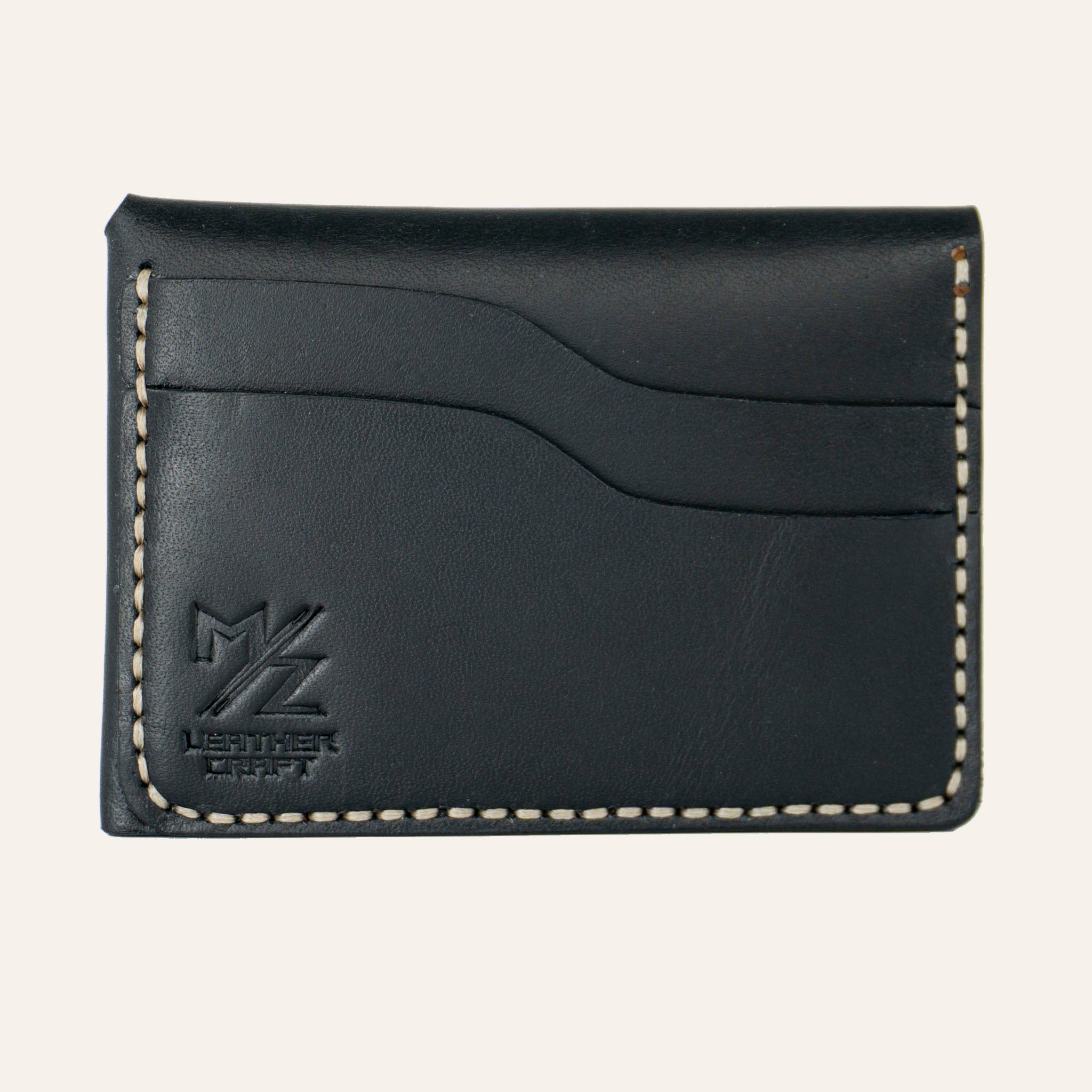 Siyah Buttero deri üzerinde el dikişi (Saddle Stitch) ustalığı