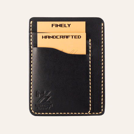 MZ Leather Craft dikey minimalist siyah Buttero deri kartlık, kartlarla dolu önden görünüm, sarı el dikişleri ve sol alt köşede kabartmalı MZ logosu | The Vertical Minimalist Cardholder - Black Buttero Leather by MZ Leather Craft, front view filled with cards, featuring yellow hand-stitching and an embossed MZ logo on the bottom left corner
