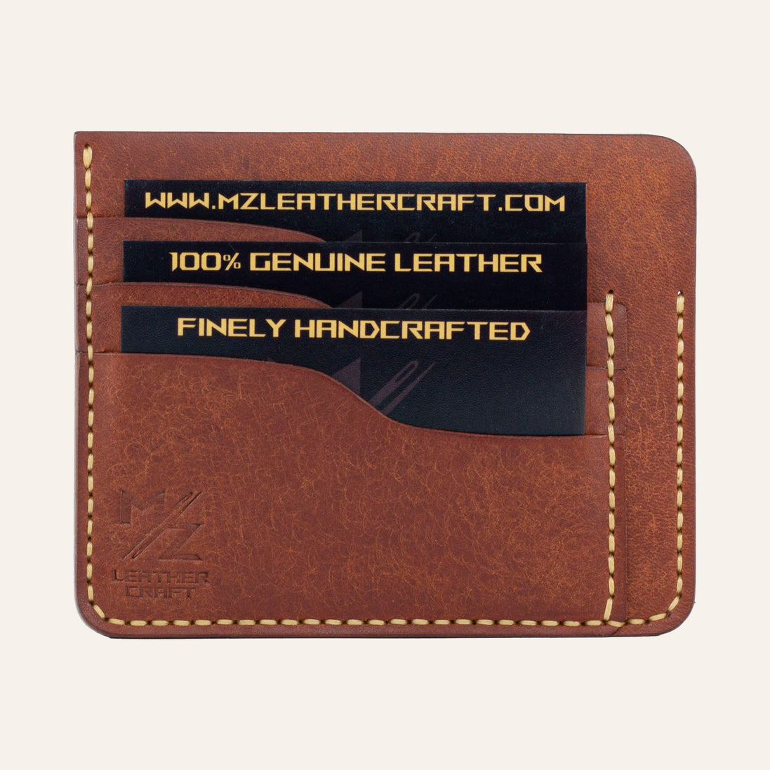 MZ Leather Craft kiremit Pueblo deri ters cüzdan, kartlarla dolu düz ön görünüm, 3 ön kart yuvası, sarı el dikişleri ve kabartmalı MZ logosu | The Inverse Wallet - Siena Pueblo Leather by MZ Leather Craft, flat front view filled with cards, featuring 3 front card slots, yellow hand-stitching, and embossed MZ logo