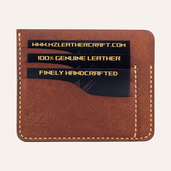 MZ Leather Craft kiremit Pueblo deri ters cüzdan, kartlarla dolu düz ön görünüm, 3 ön kart yuvası, sarı el dikişleri ve kabartmalı MZ logosu | The Inverse Wallet - Siena Pueblo Leather by MZ Leather Craft, flat front view filled with cards, featuring 3 front card slots, yellow hand-stitching, and embossed MZ logo