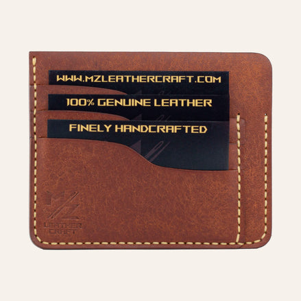 MZ Leather Craft kiremit Pueblo deri ters cüzdan, kartlarla dolu düz ön görünüm, 3 ön kart yuvası, sarı el dikişleri ve kabartmalı MZ logosu | The Inverse Wallet - Siena Pueblo Leather by MZ Leather Craft, flat front view filled with cards, featuring 3 front card slots, yellow hand-stitching, and embossed MZ logo