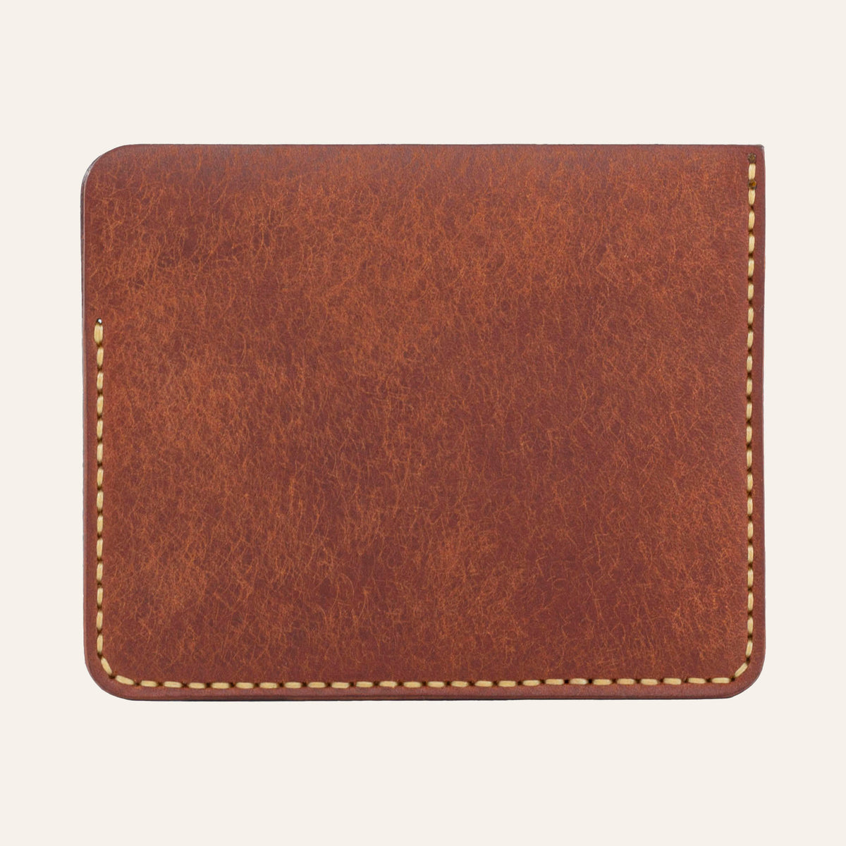 MZ Leather Craft kiremit Pueblo deri ters cüzdan, kesintisiz düz deri paneli ve çevreleyen sarı el dikişlerini gösteren arka görünüm | The Inverse Wallet - Siena Pueblo Leather by MZ Leather Craft, flat back view showcasing the seamless leather panel and surrounding yellow hand-stitching