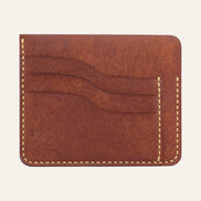 MZ Leather Craft kiremit Pueblo deri ters cüzdan, 3 boş kart yuvasını ve mat deri dokusunu gösteren düz ön görünüm, sarı el dikişleri ve kabartmalı MZ logosu | The Inverse Wallet - Siena Pueblo Leather by MZ Leather Craft, flat front view showing 3 empty card slots and matte leather texture, with yellow hand-stitching and embossed MZ logo