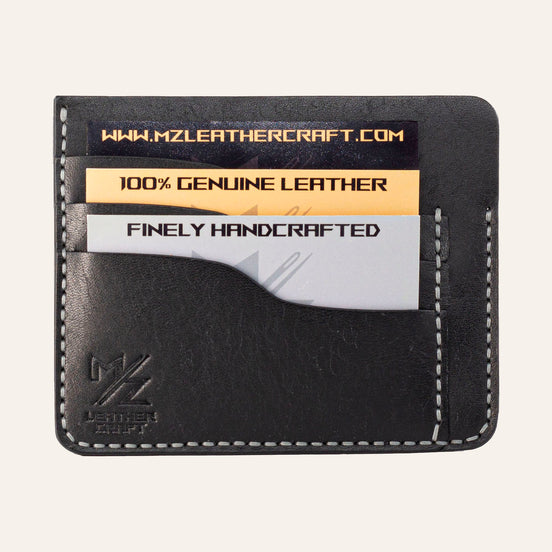 MZ Leather Craft siyah Pueblo deri ters cüzdan, kartlarla dolu düz ön görünüm, 3 ön kart yuvası, gri el dikişleri ve kabartmalı MZ logosu | The Inverse Wallet - Black Pueblo Leather by MZ Leather Craft, flat front view filled with cards, featuring 3 front card slots, gray hand-stitching, and embossed MZ logo